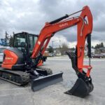 2026 Kubota KX057-5 includes heat, A/C, angle blade, 2X AUX hydraulics, coupler, hydraulic thumb, dig bucket