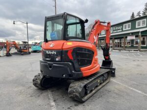 2026 Kubota KX057-5 includes heat, A/C, angle blade, 2X AUX hydraulics, coupler, hydraulic thumb, dig bucket - Image 3
