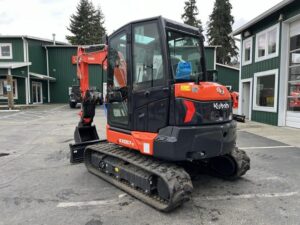 2026 Kubota KX057-5 includes heat, A/C, angle blade, 2X AUX hydraulics, coupler, hydraulic thumb, dig bucket - Image 4
