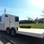 8.5×24 White Hybrid Enclosed V nose (2) 7K axles (2) 30×30 Windows No rails Pintle Hitch