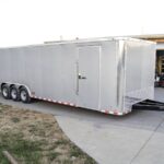 8.5×32 Silver Enclosed Car Hauler Trailer With Ramp and side door (3) 7K Axles 21k GVWR