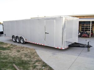 8.5×32 Silver Enclosed Car Hauler Trailer With Ramp and side door (3) 7K Axles 21k GVWR