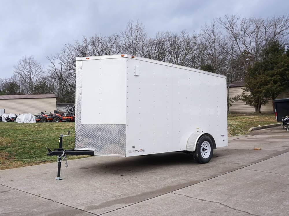 6′ X 12′ White Enclosed V-Nose Trailer with Diamond Plate Floor Storage 6′ X 12′ White Enclosed V-Nose Trailer with Diamond Plate Floor Storage - Image 1